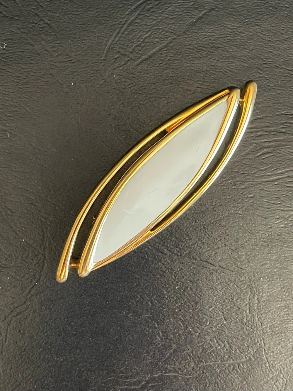 Vintage Monet Gold Tone & color enamel Marquise brooch.